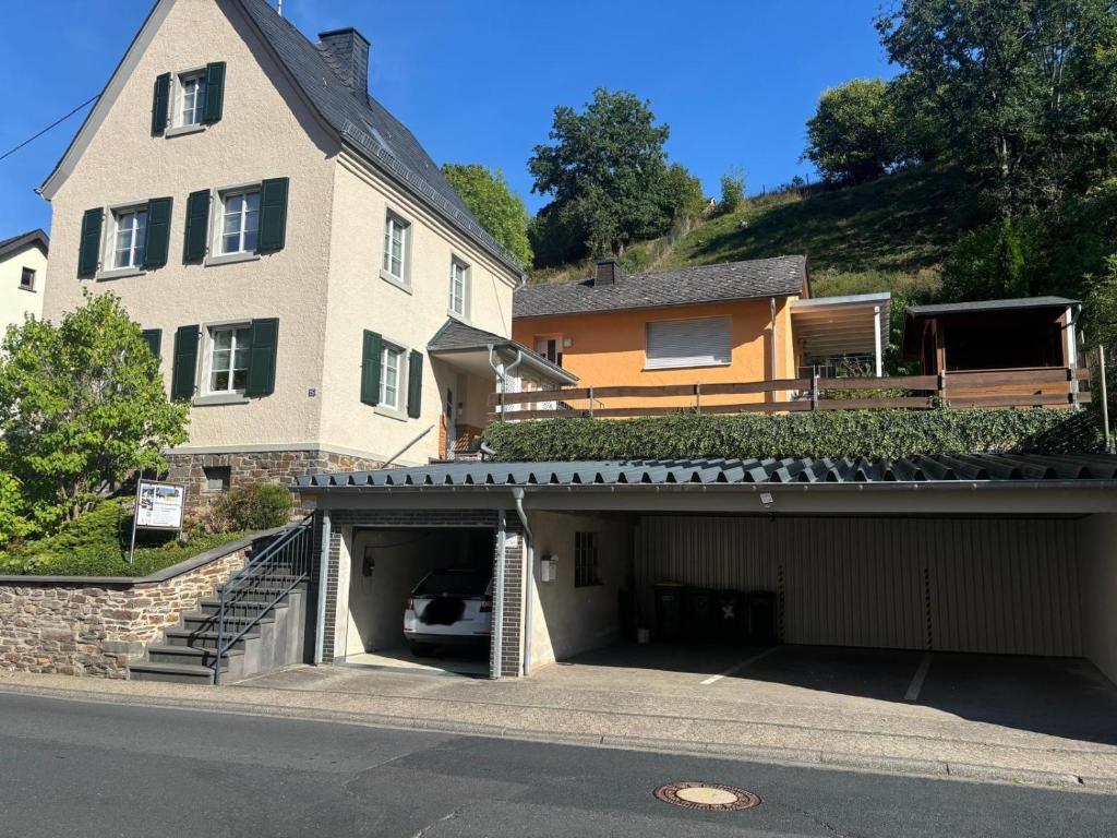 a garage in front of a house with a building at Philippsburg in Monreal
