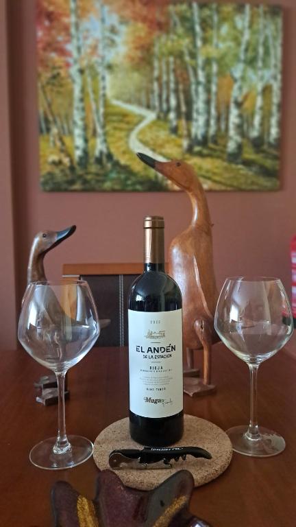 a bottle of wine sitting on a table with two glasses at Garnacha Tinta VT-LR-2179 in Haro