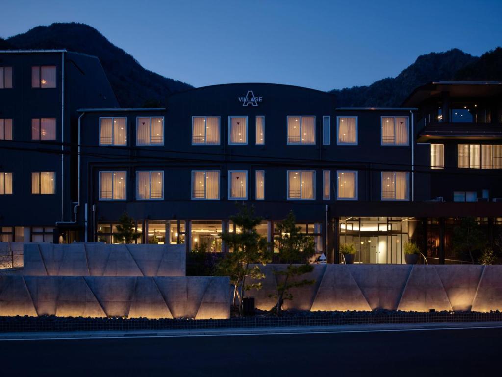 a building with lights on in front of it at A village in Fujikawaguchiko
