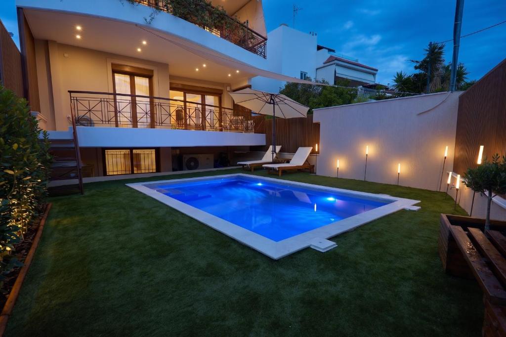 a swimming pool in the backyard of a house at Elegant Villa In Vari With Private Pool in Vari