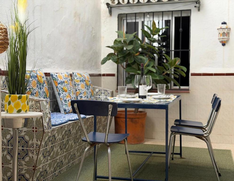 a table and chairs in front of a window at Casa Hjort in Nerja