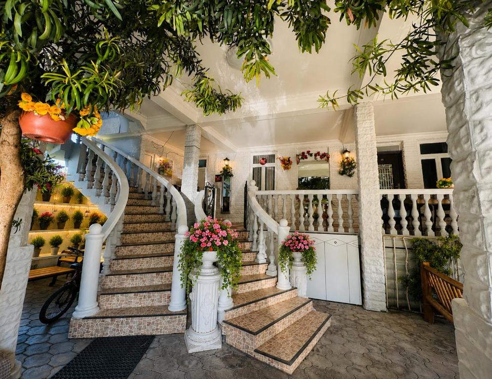 a staircase in a house with flowers on it at Twins Kobuleti in Kobuleti