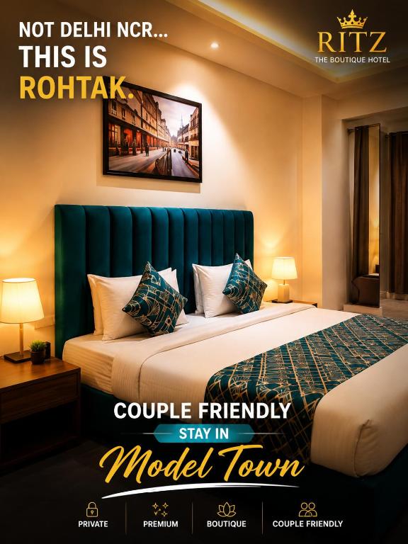 a hotel room with a bed with a blue headboard at Ritz The Boutique Hotel in Rohtak