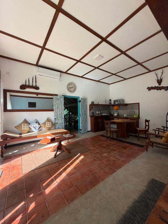 a living room with a table in a room at Lobo's Retreat in Kurunegala