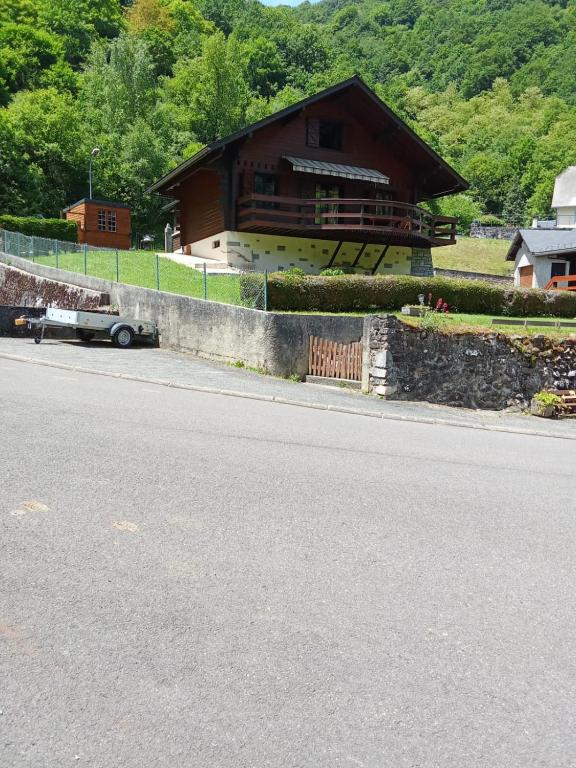 a building on the side of a road with a house at Chalet Borce 64 in Borce