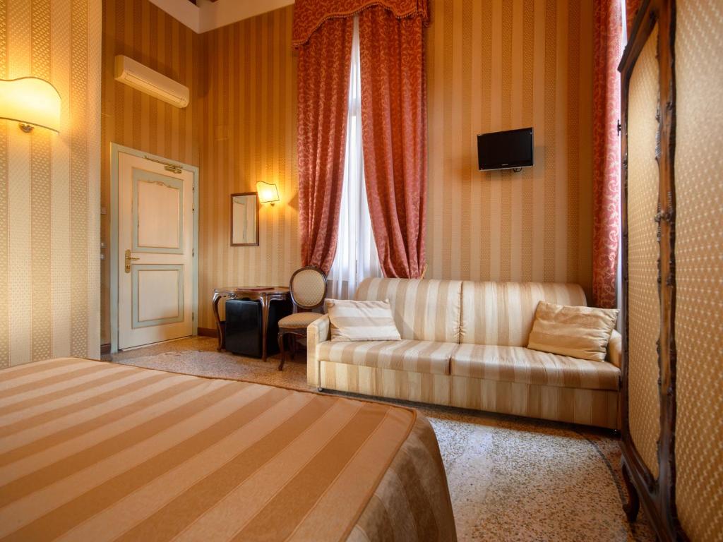 Postel nebo postele na pokoji v ubytování Centauro Hotel