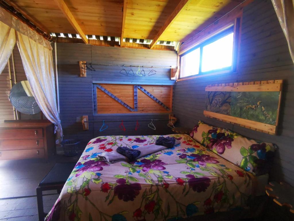 a bedroom with a bed in a small room at Wagon Wheel Gabin in Chrissiesmeer
