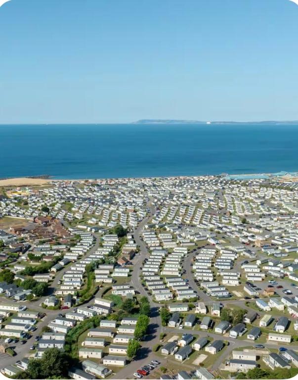 an aerial view of a parking lot next to the ocean at Brand New Caravan in Selsey