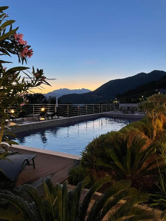 a view of a swimming pool with mountains in the background at Serenity De Lluxe in Kavač