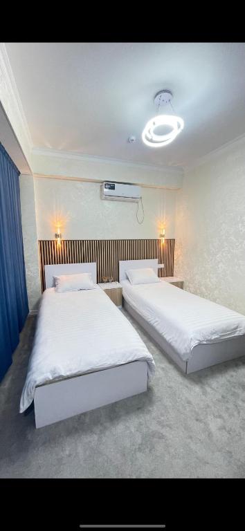a bedroom with two beds at Rest hotel in Samarkand