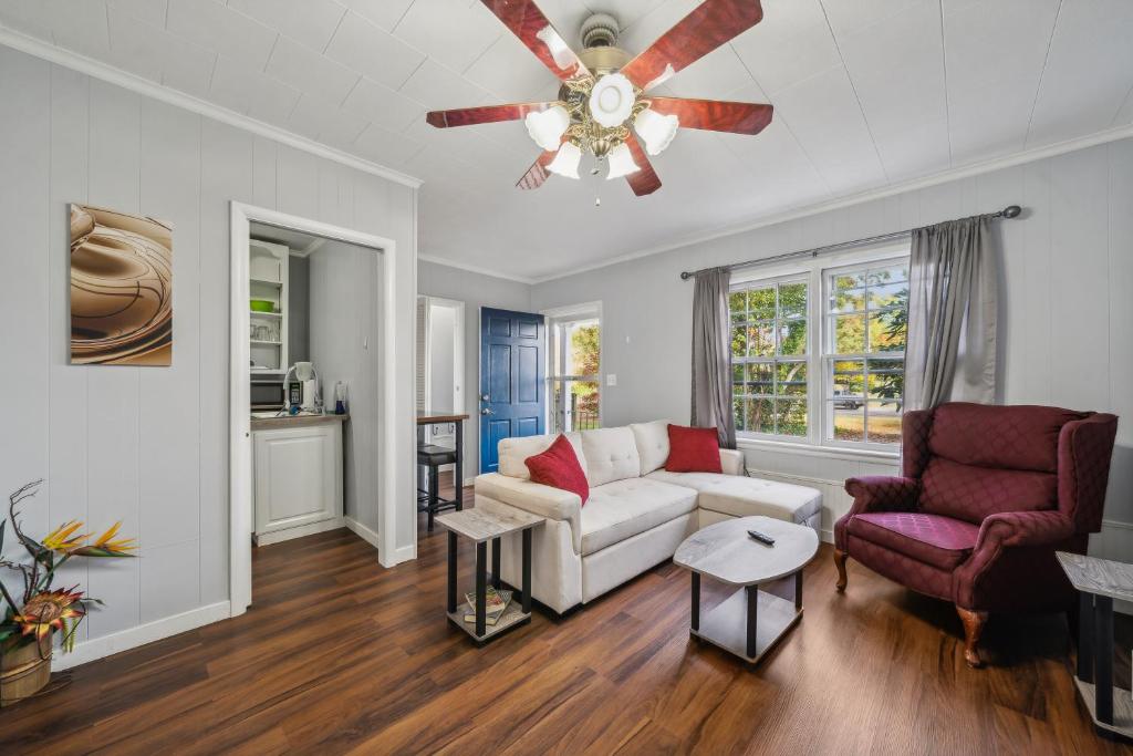 a living room with a couch and a ceiling fan at A Little Serenity in Onancock