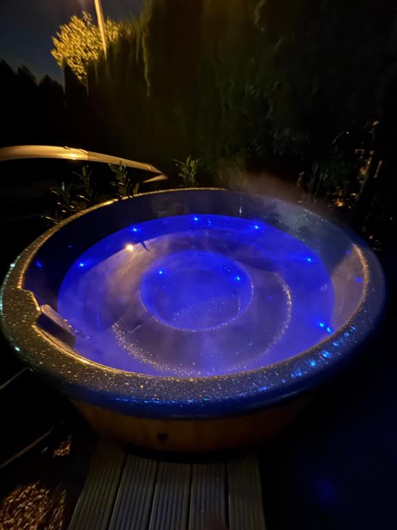 a blue bath tub with lights in it at Apartament Ana in Lublin