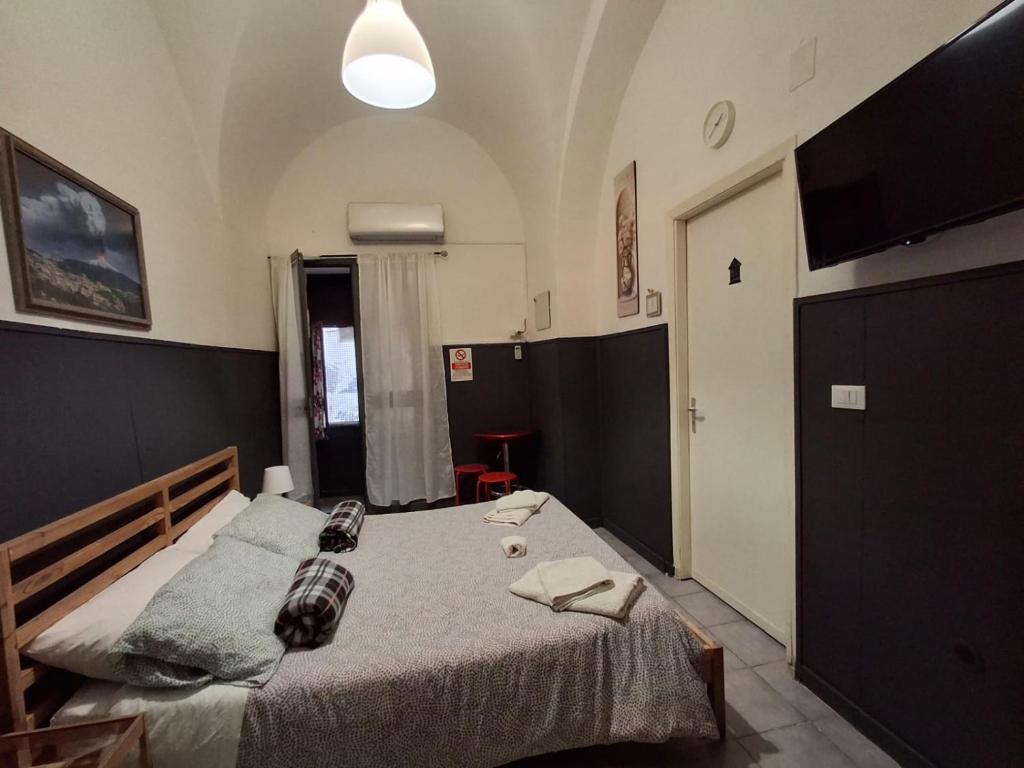 a bedroom with a large bed in a room at Palazzo Ruisi in Scordia