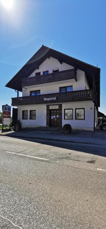 a large white building on the side of a street at Hotel Restaurant Ampertal in Haag an der Amper