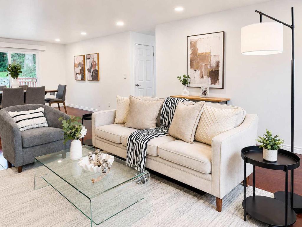 a living room with a couch and a table at Bellevue Pet friendly Home Fenced Yard in Bellevue