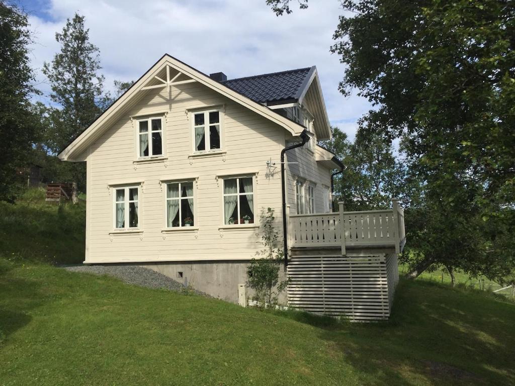 a white house on the side of a hill at Senja, Villa View in Senja