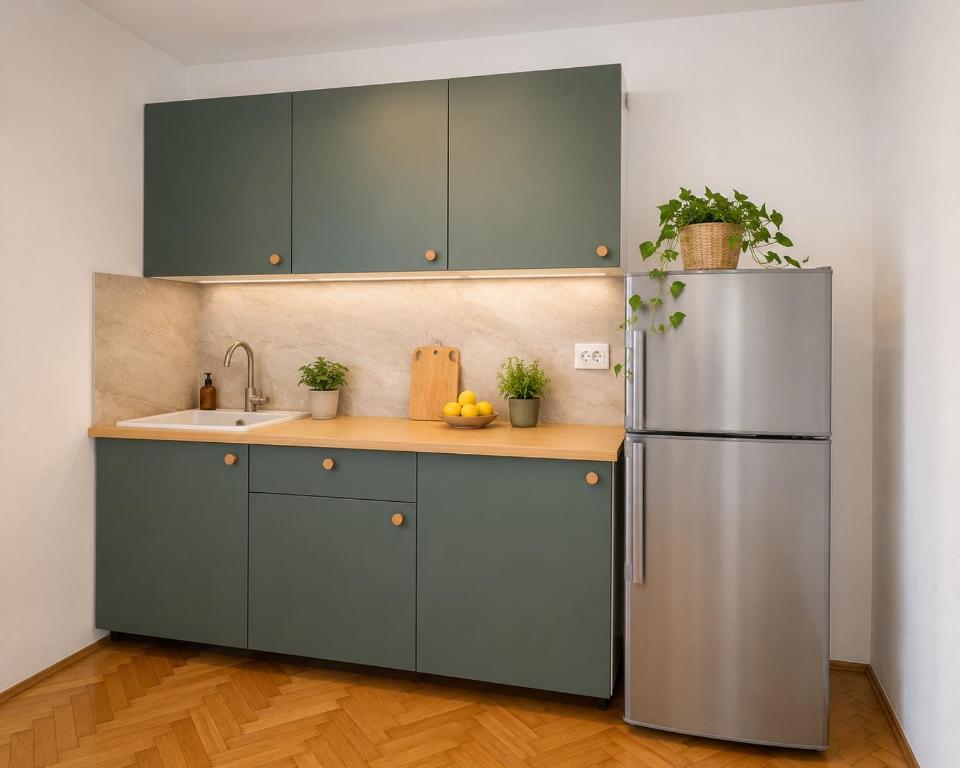 a kitchen with a refrigerator and a sink at Apartments Marko in Vodice