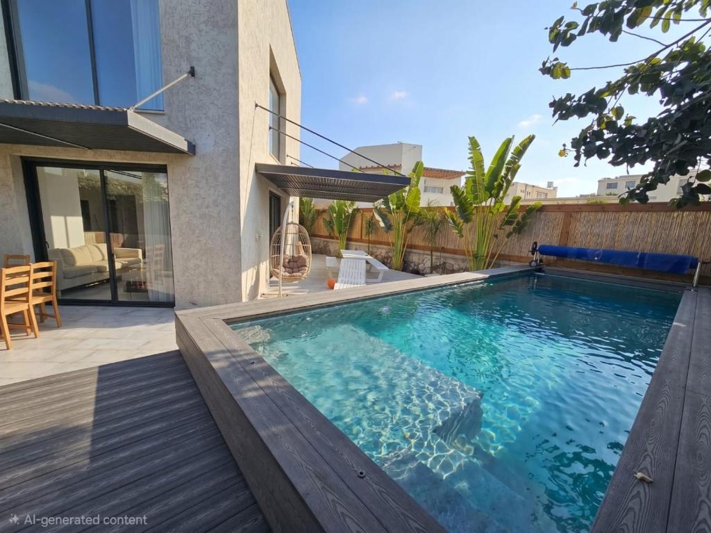 a swimming pool in the backyard of a house at צוקים אילת in Eilat