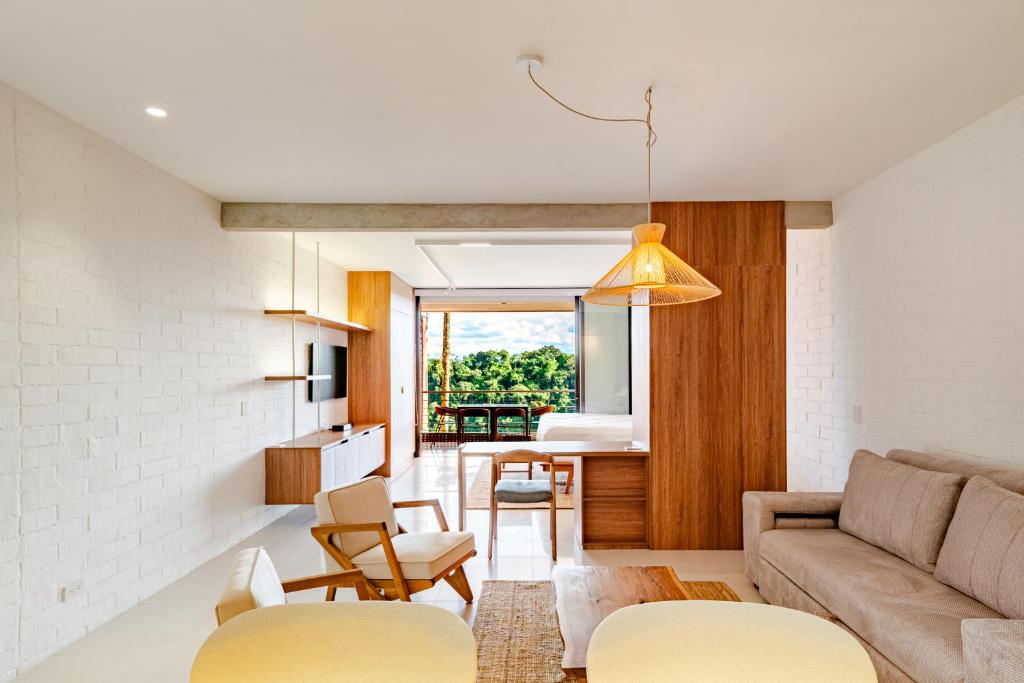 a living room with a couch and a table at Selva Vista in Pereira
