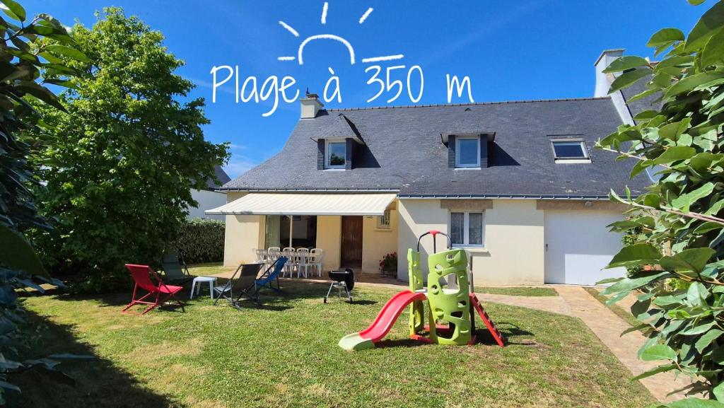 a house with a playground in front of it at Maison 5 chambres, 3 SdB, proche plage in Arzon