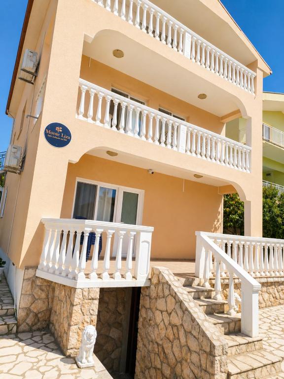 a villa with a view of the house at Monte Liza Apartments in Dobra Voda
