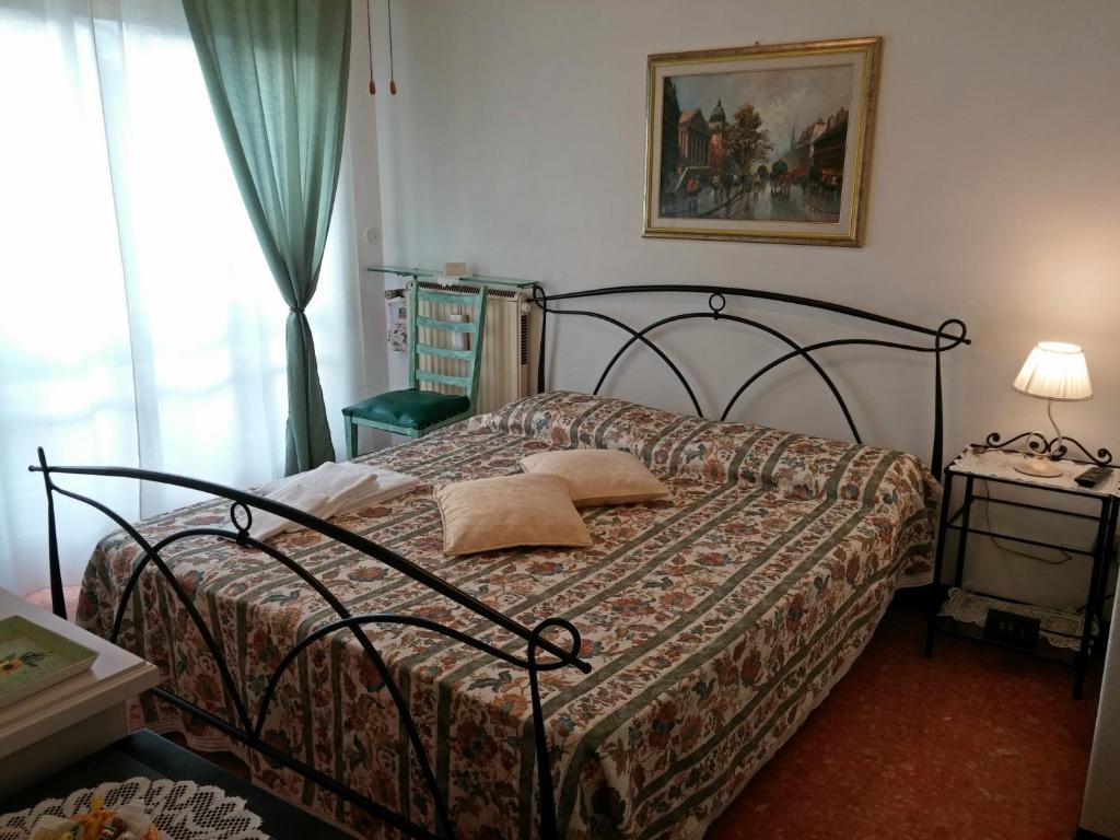 Postel nebo postele na pokoji v ubytování Le Midi Versilia