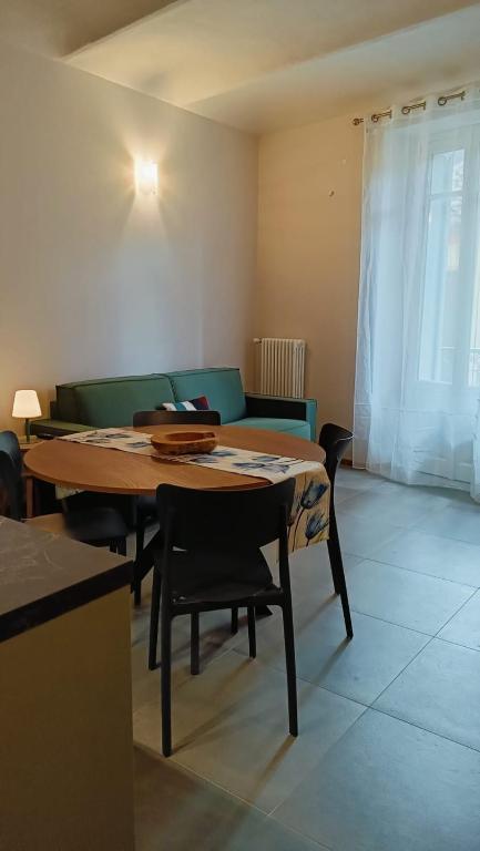 a living room with a table and a couch at A casa di Anna in Cocconato
