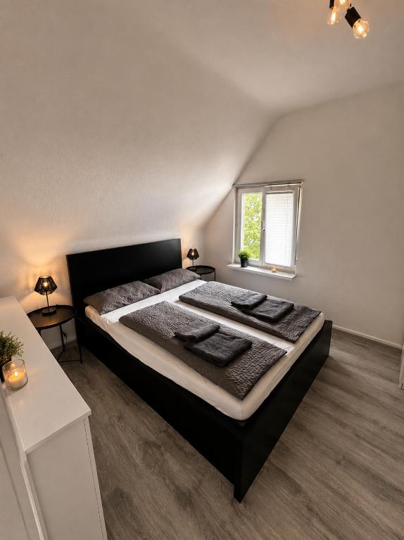a bedroom with a large bed in a room at STAY - City W32 in Friedrichshafen