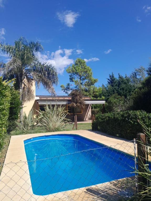 a swimming pool in the yard of a house at Casa Las Tardes, Roldan in San Lorenzo