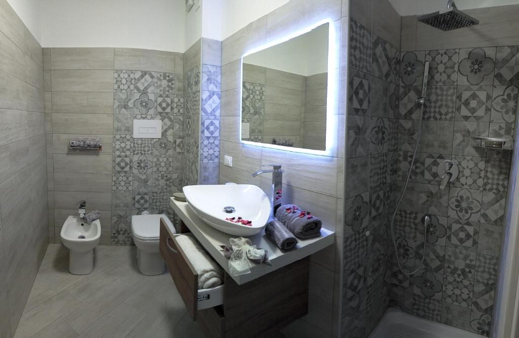 Ванная комната в La Rosa Del Garda Apartment