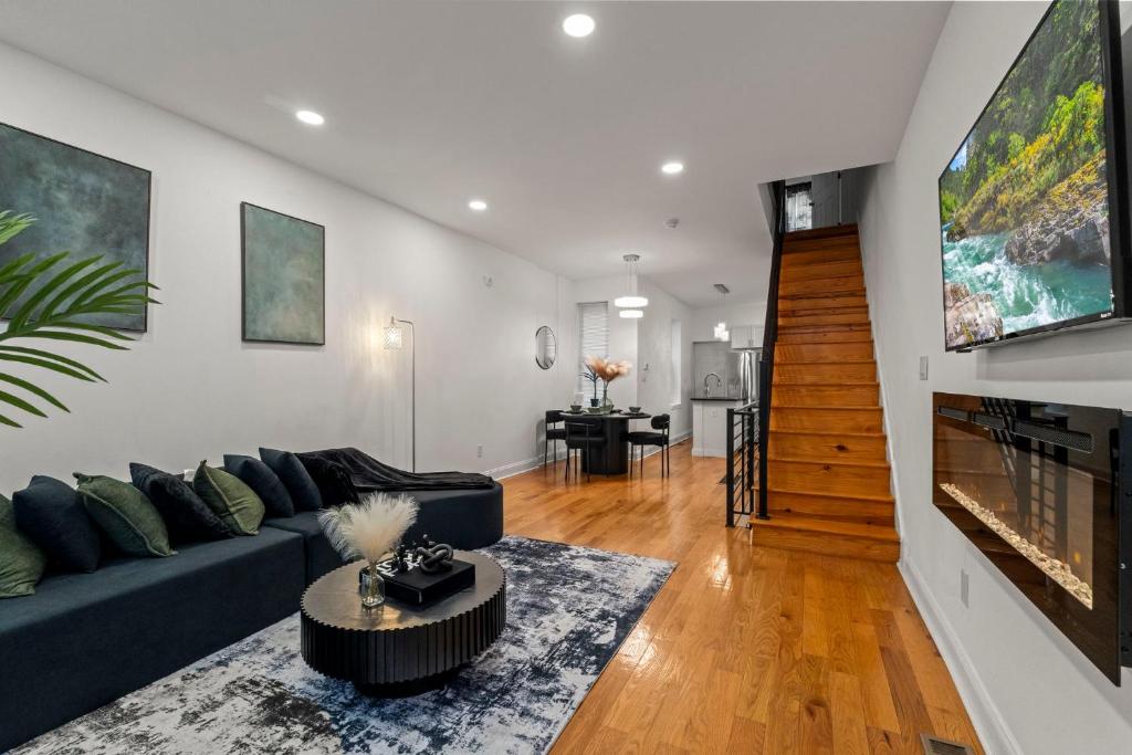 a living room with a couch and a tv at Modern 3BR Home Patio Near Center City Free Parkin in Philadelphia
