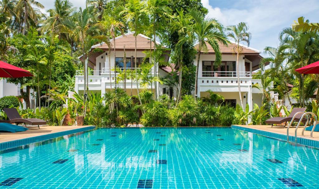 a swimming pool in front of a villa at EASY TIME VILLA by MARALEINA in Koh Samui