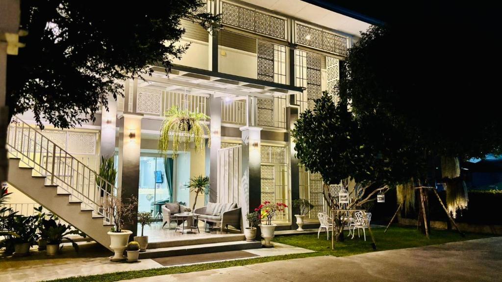 a house with a staircase leading up to it at The Viera Chiangrai in Chiang Rai
