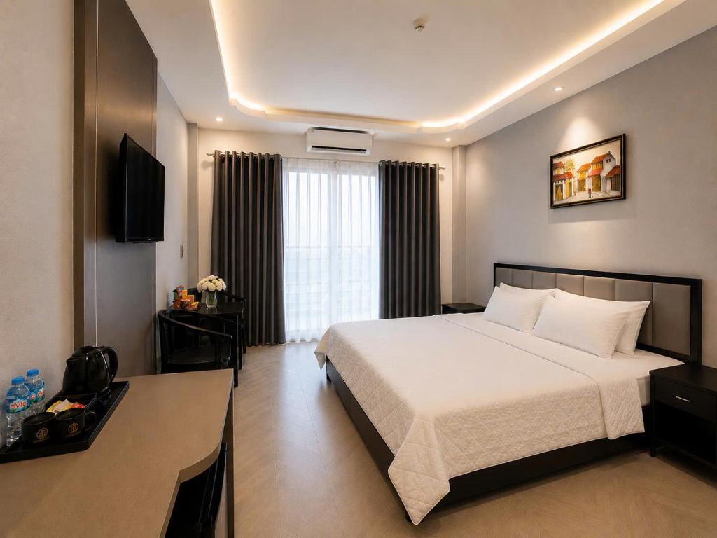a hotel room with a bed and a window at B&N HOTEL Hải Tiến in Mỹ Ðuc
