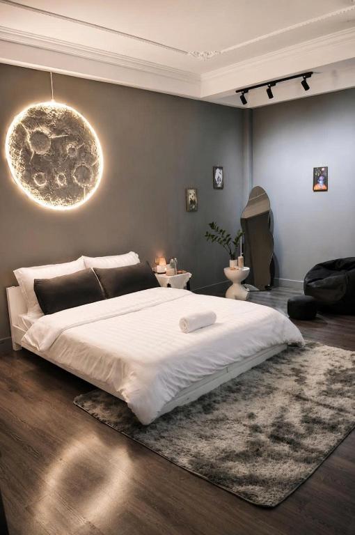 a bedroom with a large white bed in a room at BeHomestay in Hai Phong