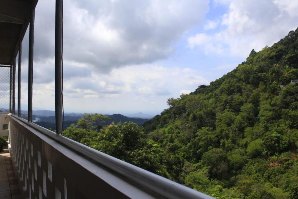 a view of a mountain from a balcony at Terra Vista Hotel in El Guayabo