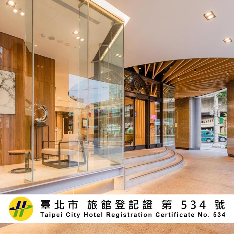 a large glass display case in a hotel lobby at Green World Grand NanJing in Taipei