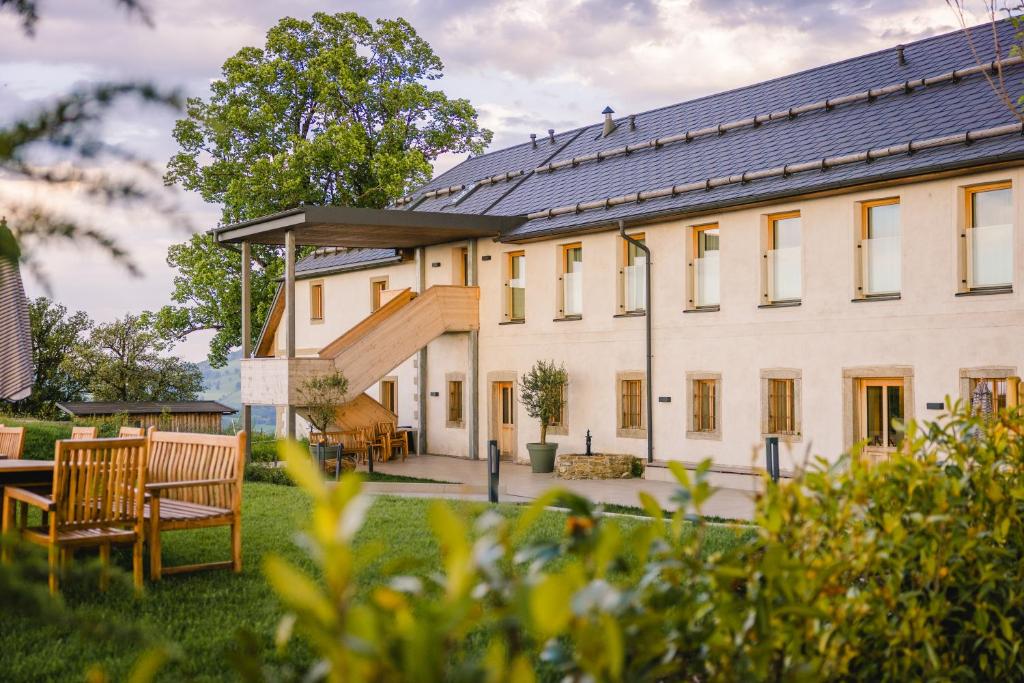 a large white building with a solarium on it at Gut Herzogberg in Sonntagberg