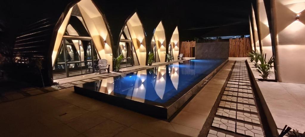 a swimming pool in the middle of a building at Lokal Hotels Dauin in Dauin