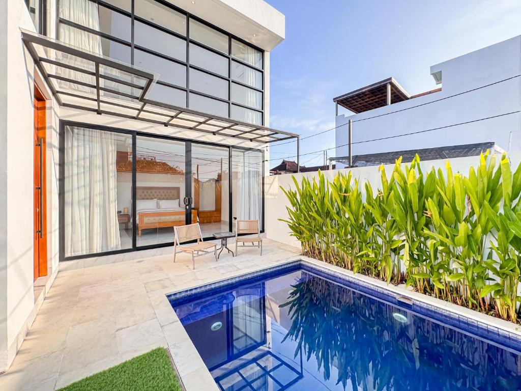 an image of a house with a swimming pool at Villa Exquisite Central Seminyak by Nagisa Bali in Seminyak