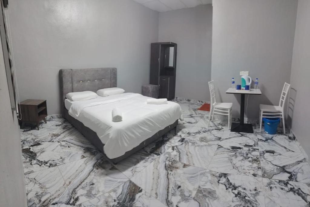 a bedroom with a bed sitting on a pile of rubble at GP StayIn in Lunas