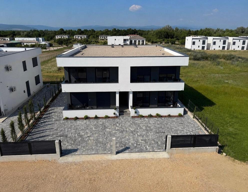 an aerial view of a large white house at Apartments Lialda in Donji Štoj