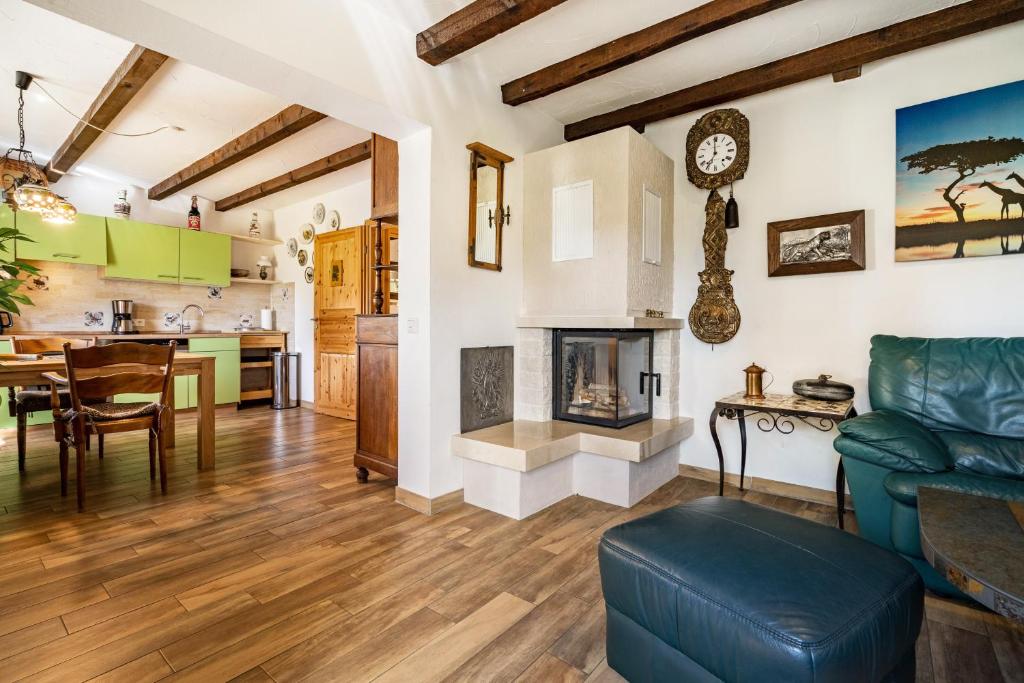 a living room with a couch and a fireplace at Landsitz Blankensee in Blankensee