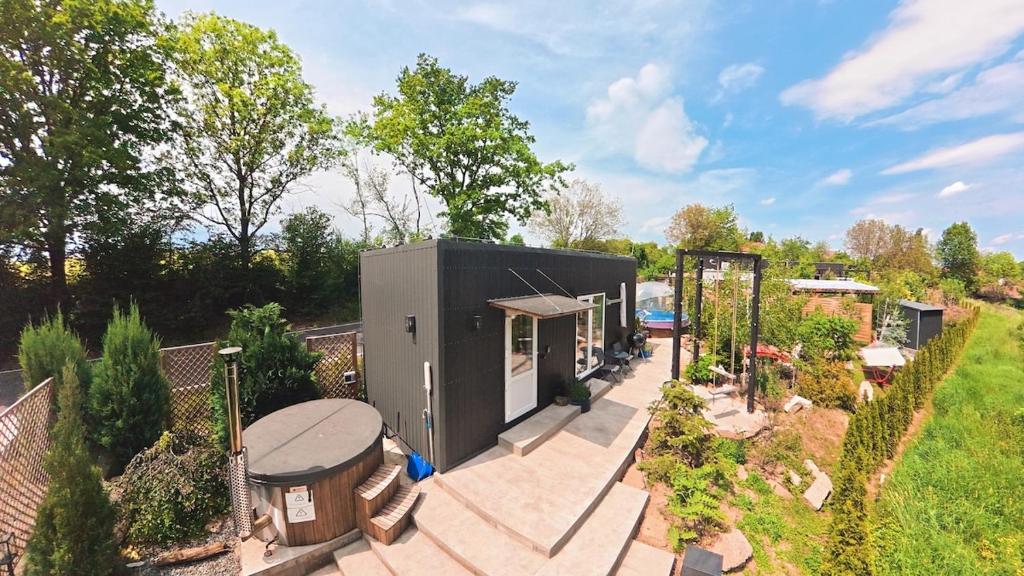 an overhead view of a tiny house in a garden at Garden Residence - The Lotus in Drahobudice
