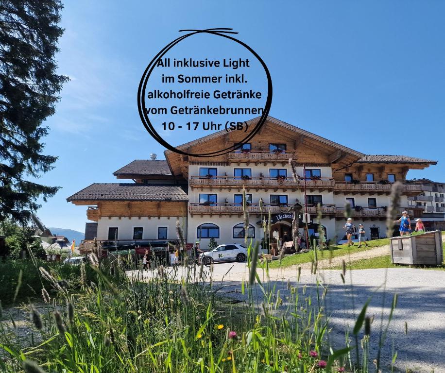 a building with a sign in front of it at Hotel Lärchenhof in Katschberghöhe