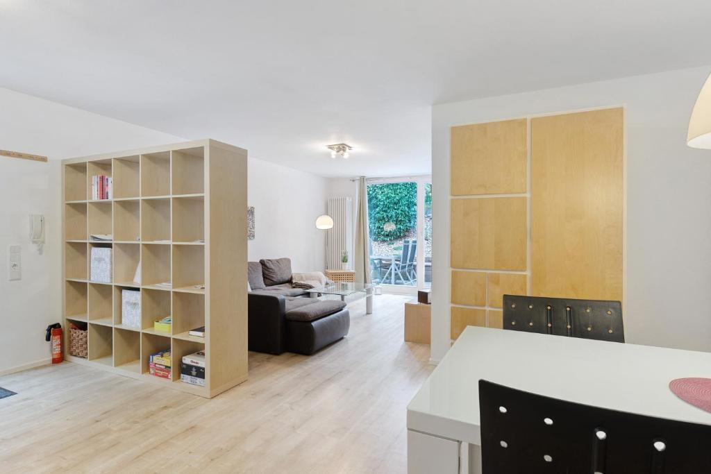 a living room with a couch and a table at Premium Ferienwohnung Dörr in Singen