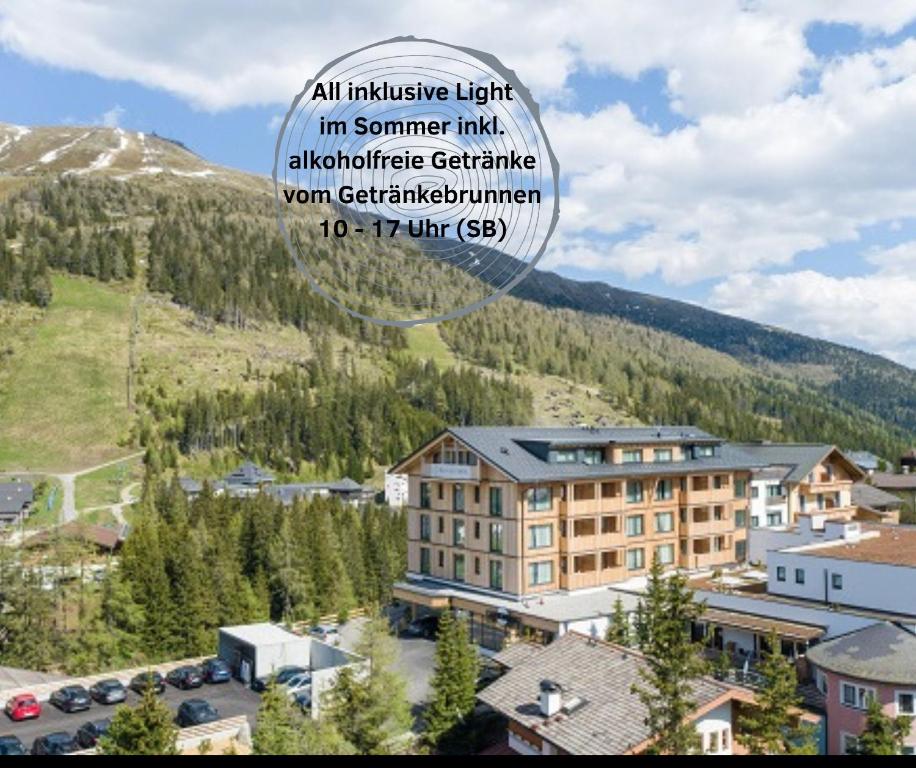 an advertisement for a hotel in the mountains at Das KATSCHBERG Superior in Katschberghöhe