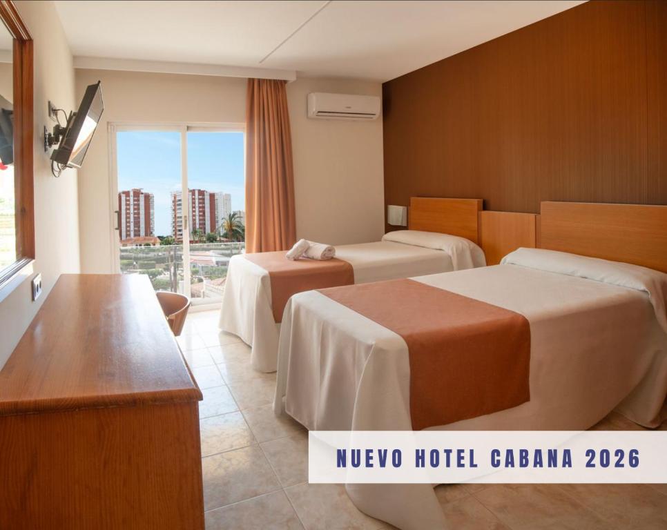 a hotel room with two beds and a balcony at Hotel Cabana in Benidorm