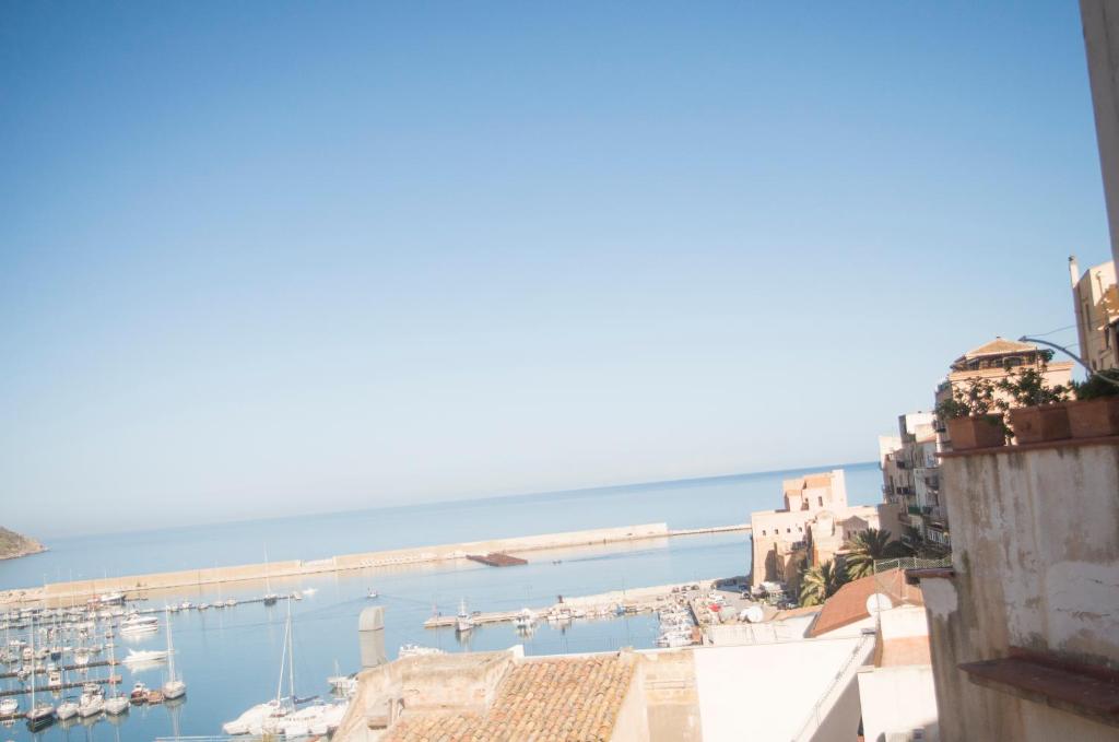 a view of a harbor with boats in the water at Chibedda Dimora Cesca in Castellammare del Golfo