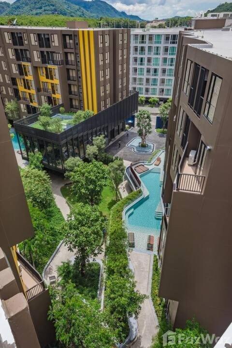 an aerial view of a swimming pool in a city at The Base Central Phuket-a modern comfort condo-sso in Ban Rangeng